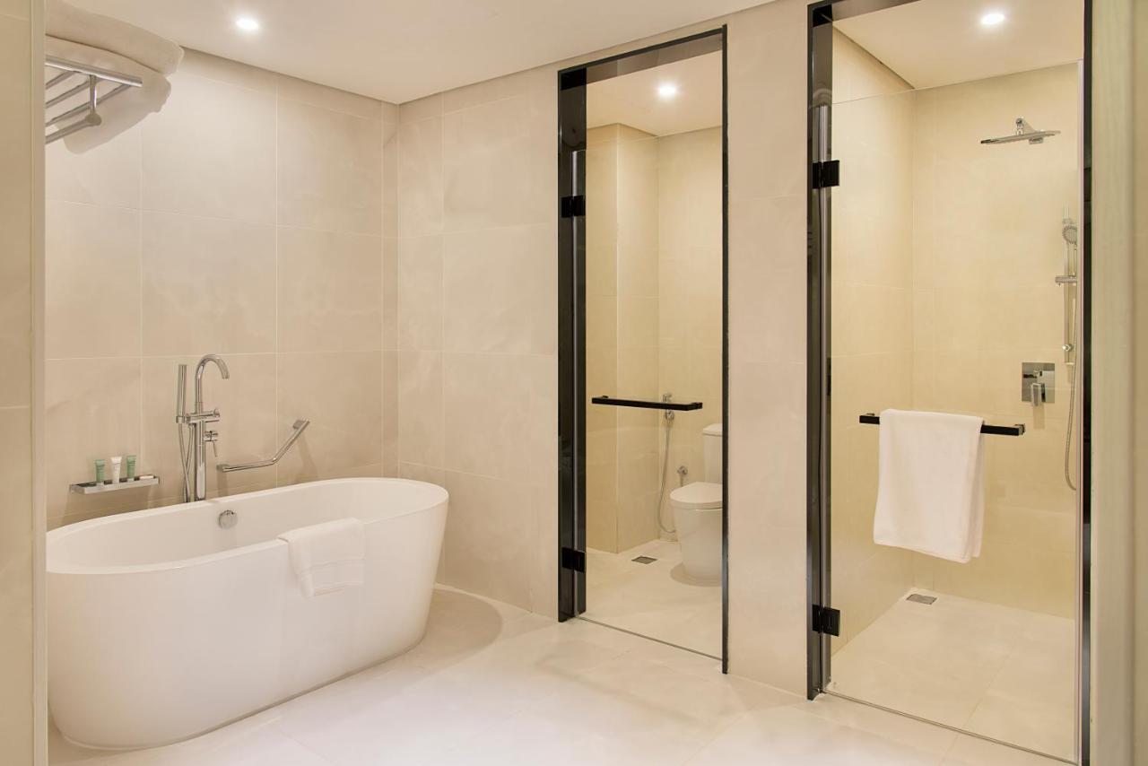 Asiana Grand Hotel Dubai Exterior photo A modern bathroom with a shower and a bathtub