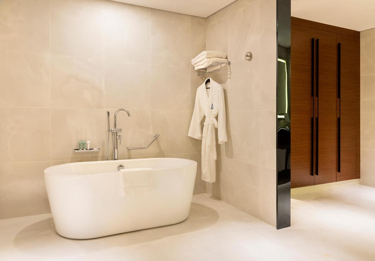 Asiana Grand Hotel Dubai Exterior photo A freestanding bathtub