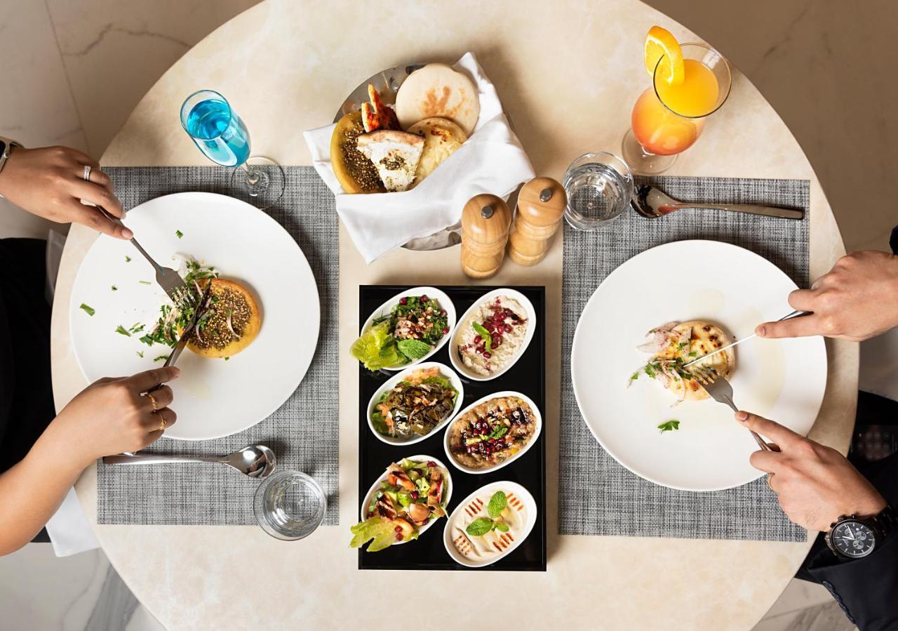 Asiana Grand Hotel Dubai Exterior photo A selection of meze
